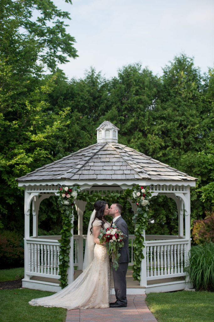 Couple in the Chocksett Inn Gazebo - an elegant wedding venue in Worcester County