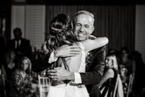 Father smiling as he dances with his little girl on her wedding day