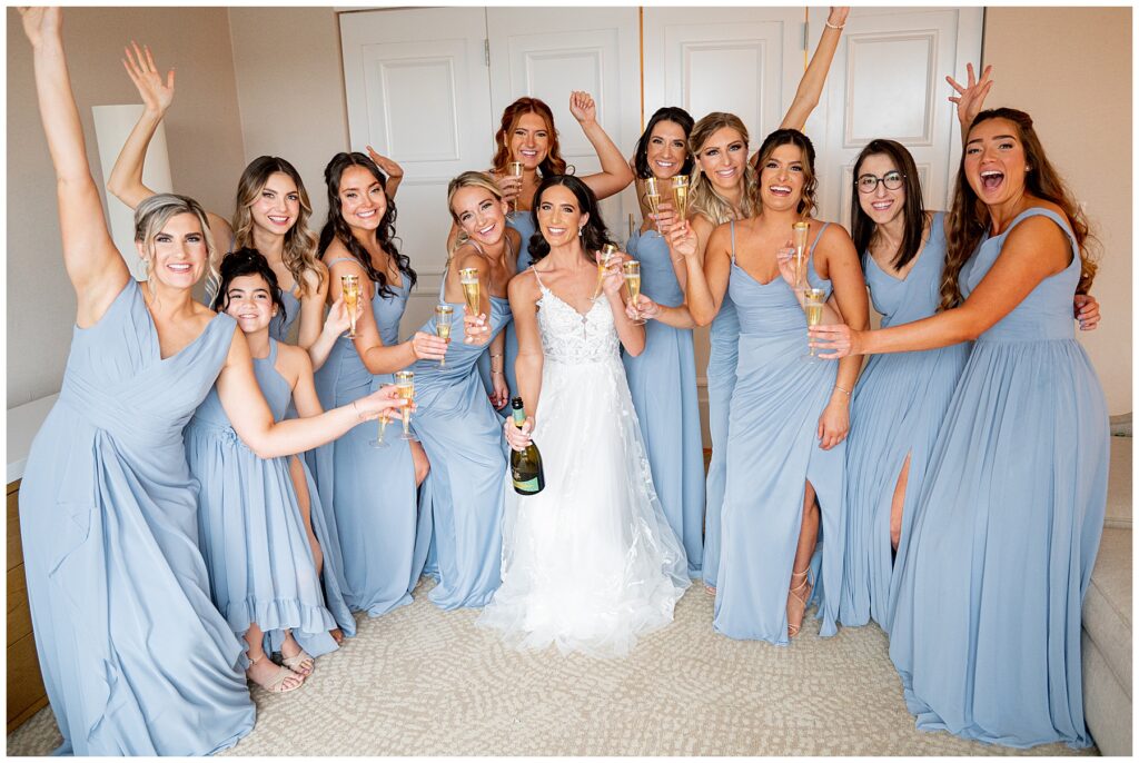 bridesmaids cheering the bride during getting ready 