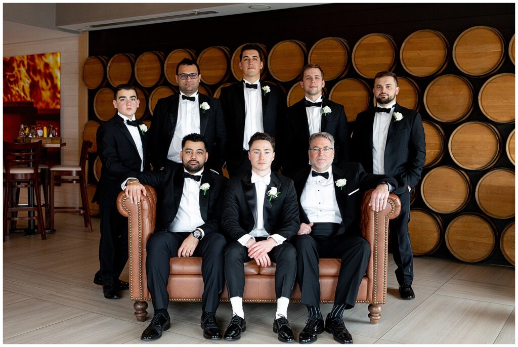 groomsmen gather for a photo with the newport groom before the wedding ceremony