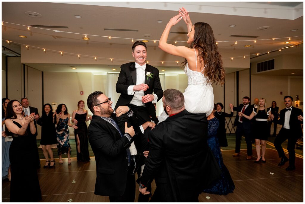 bride and groom dance with guests at their Newport Marriott Hotel Wedding reception 