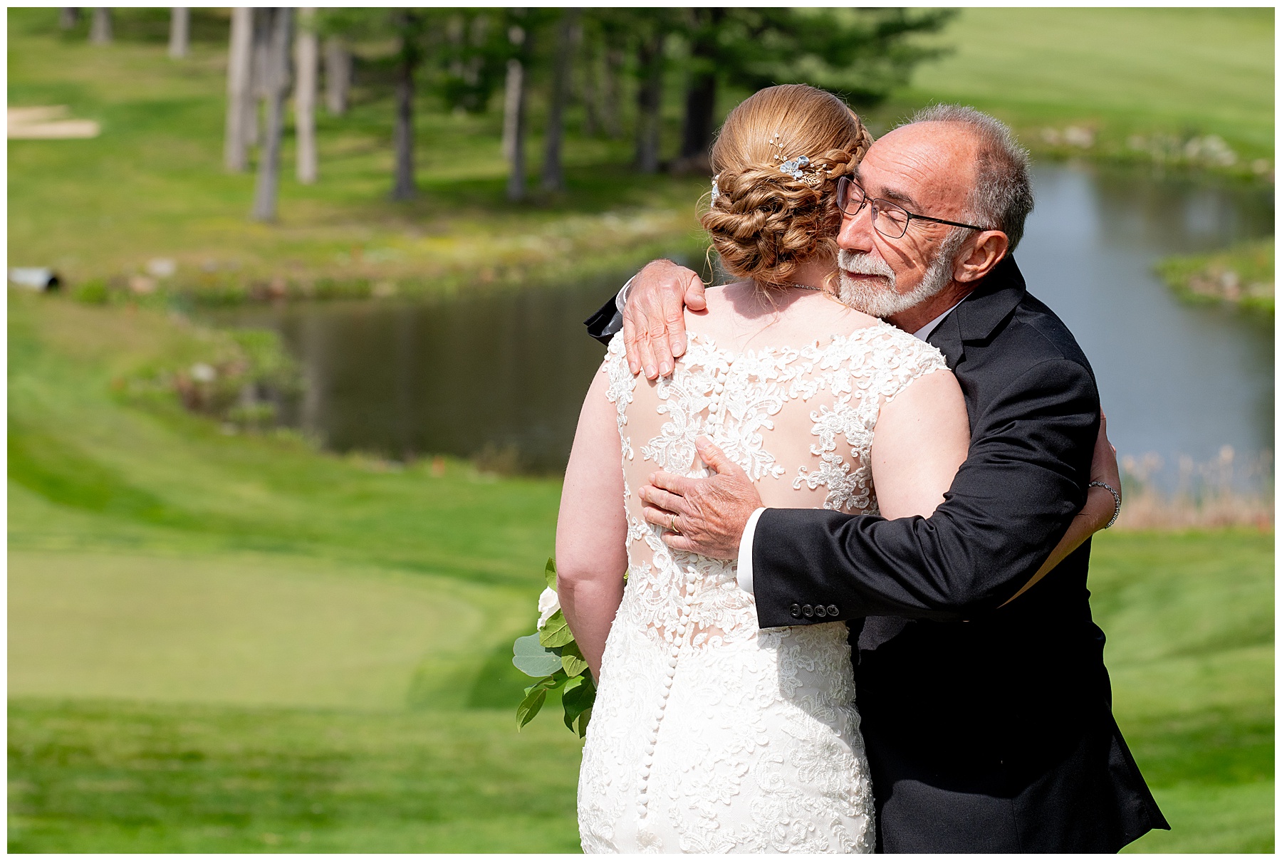 the bride and her father hug 