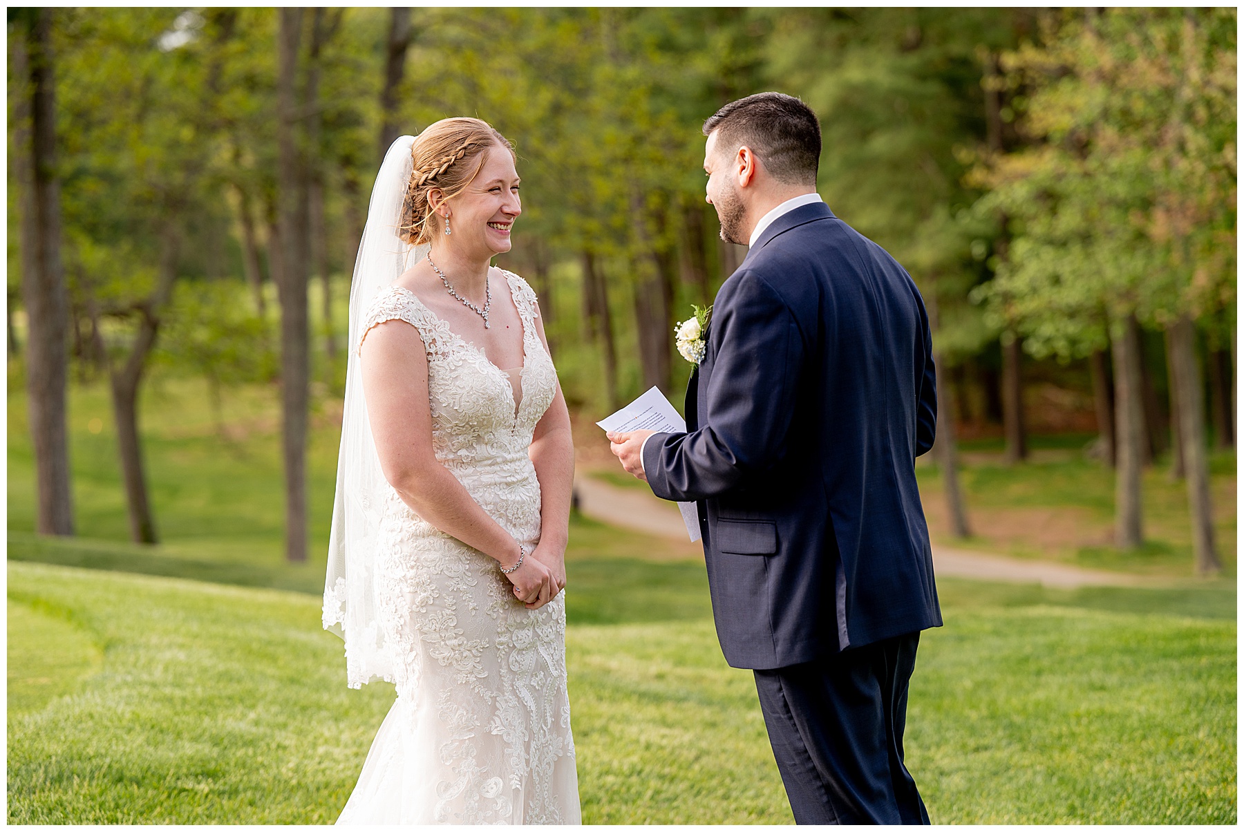 bride and groom read private vows to each other 