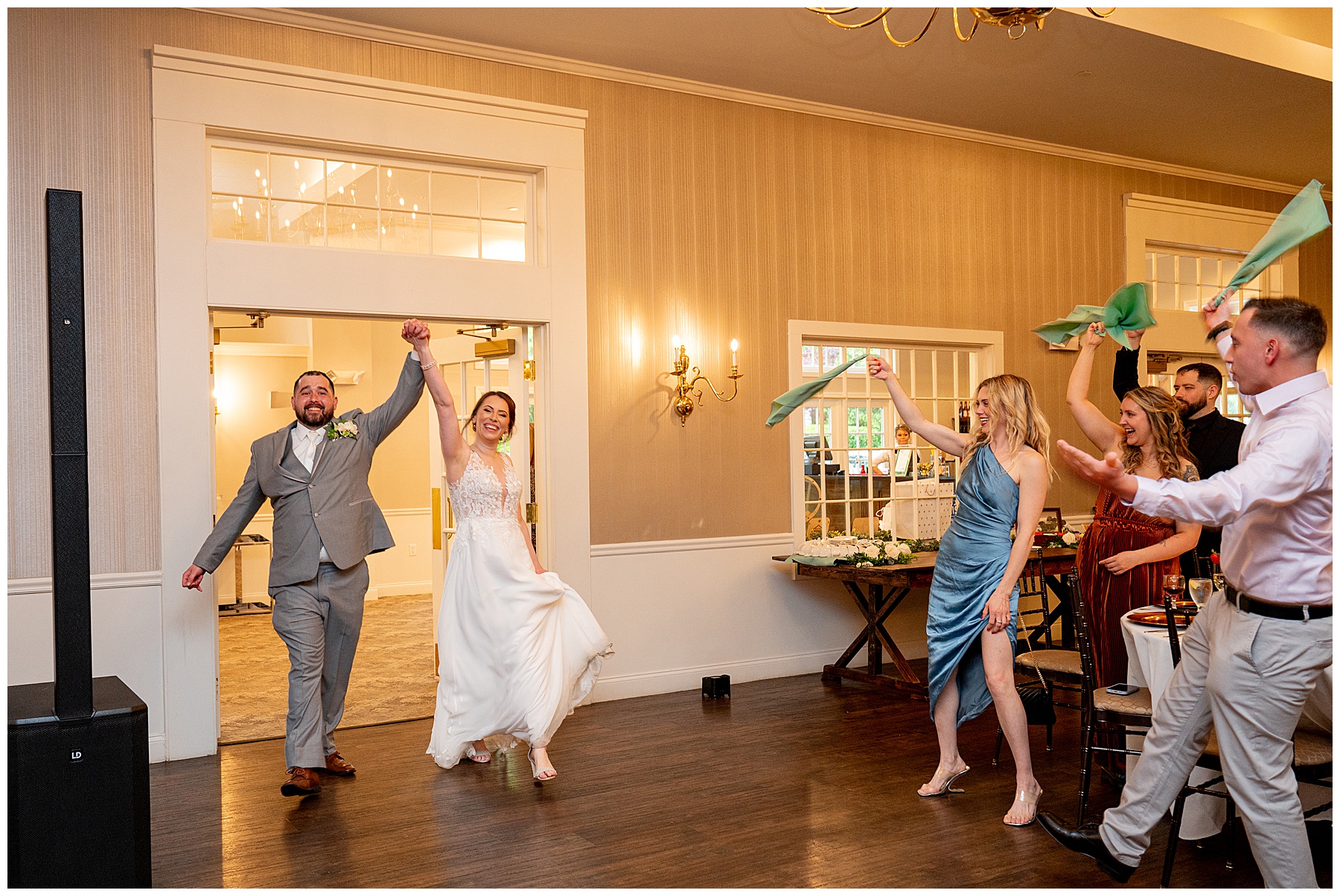 Bride and groom walking in to their reception at The Chocksett Inn