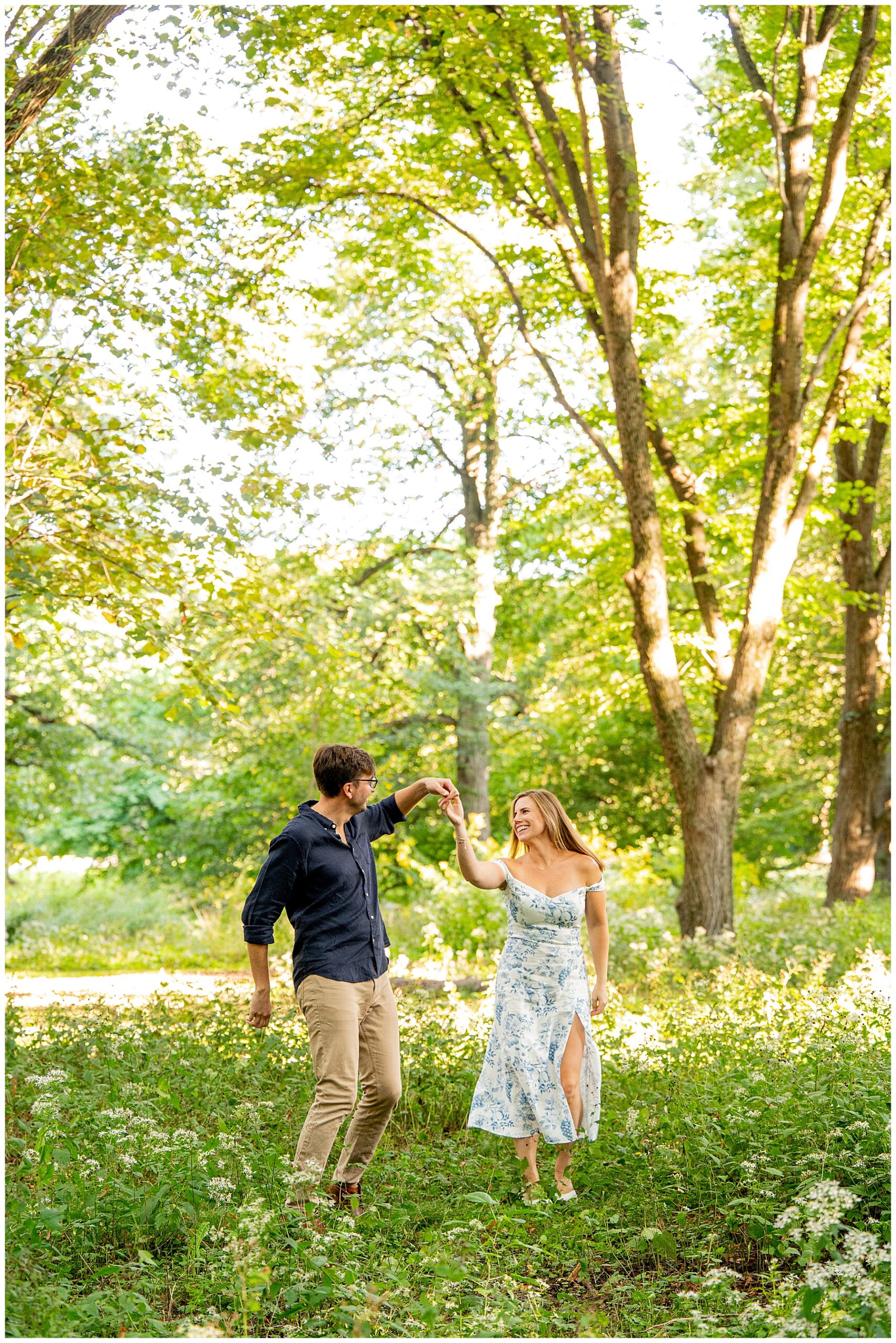 the happy couple dancing at Arnold Arboretum during their Engagement Session 