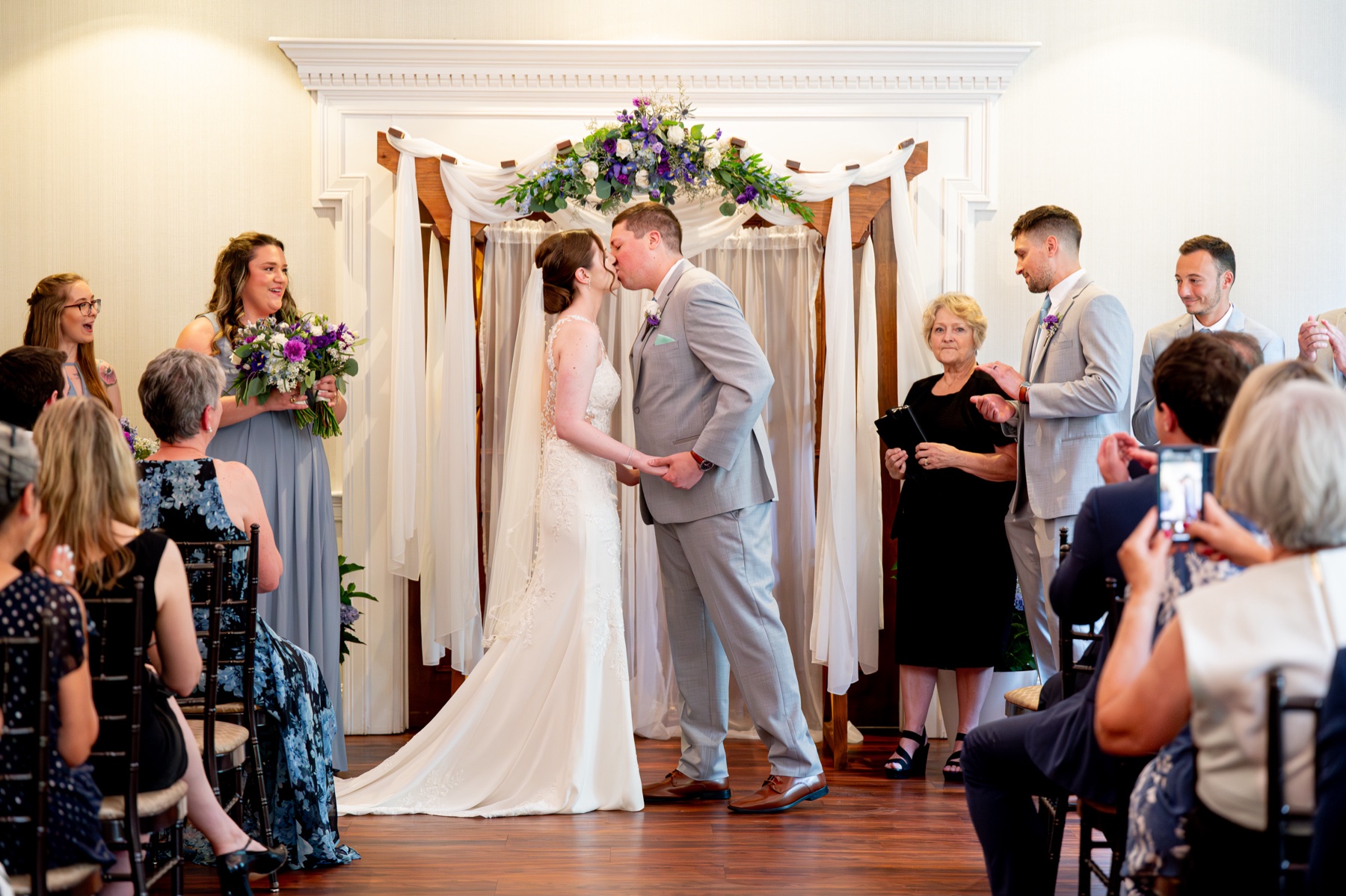 bride and groom kiss at the end of their wedding ceremony 