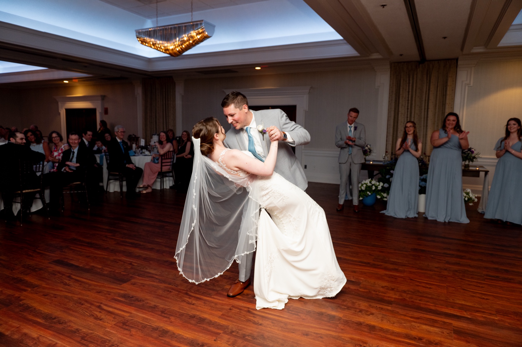 groom dipping bride during their first dance 