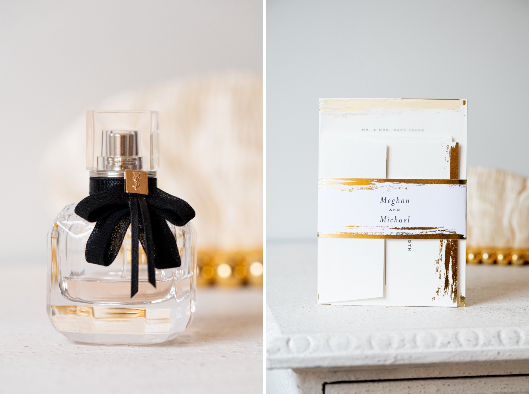 bottle of perfume with black ribbon and white and gold wedding invitation 