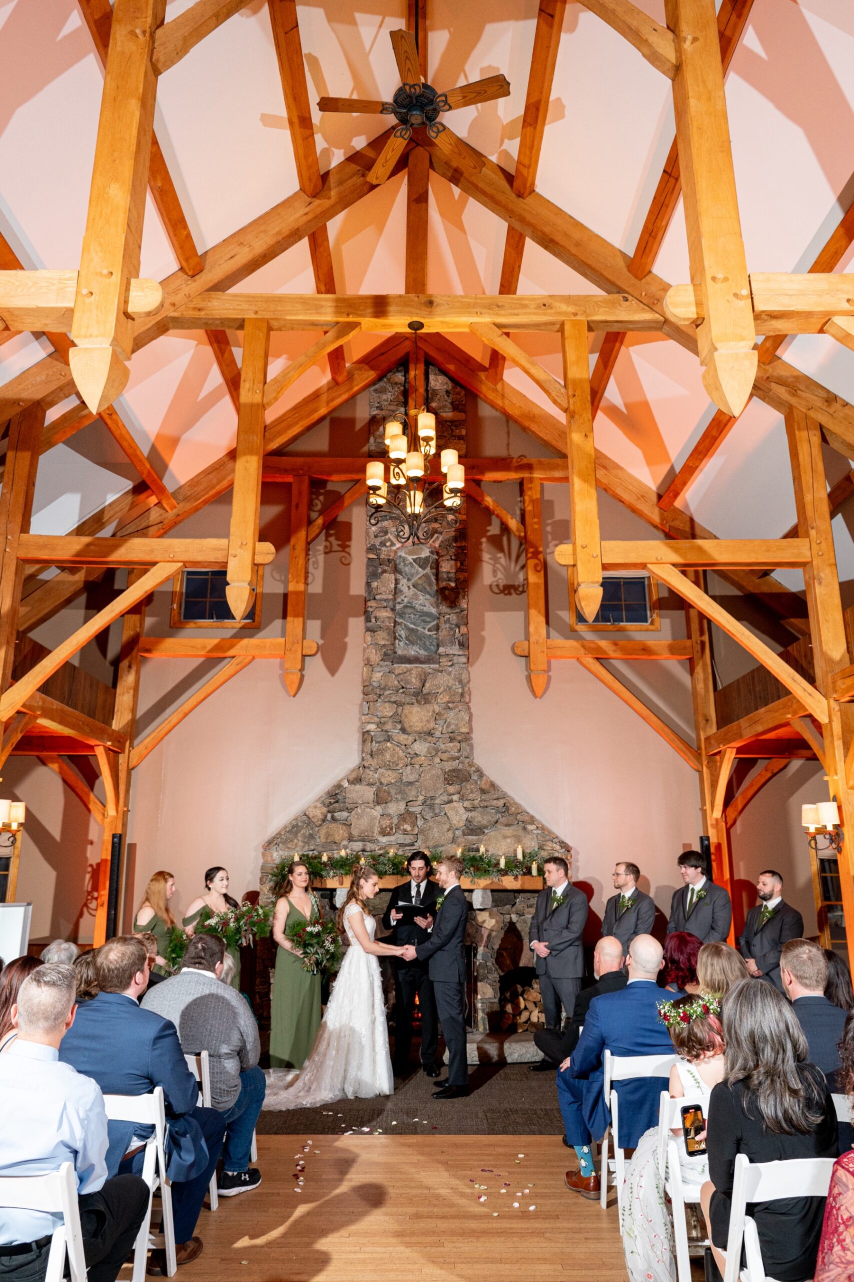 wedding ceremony with high ceilings and wooden beams