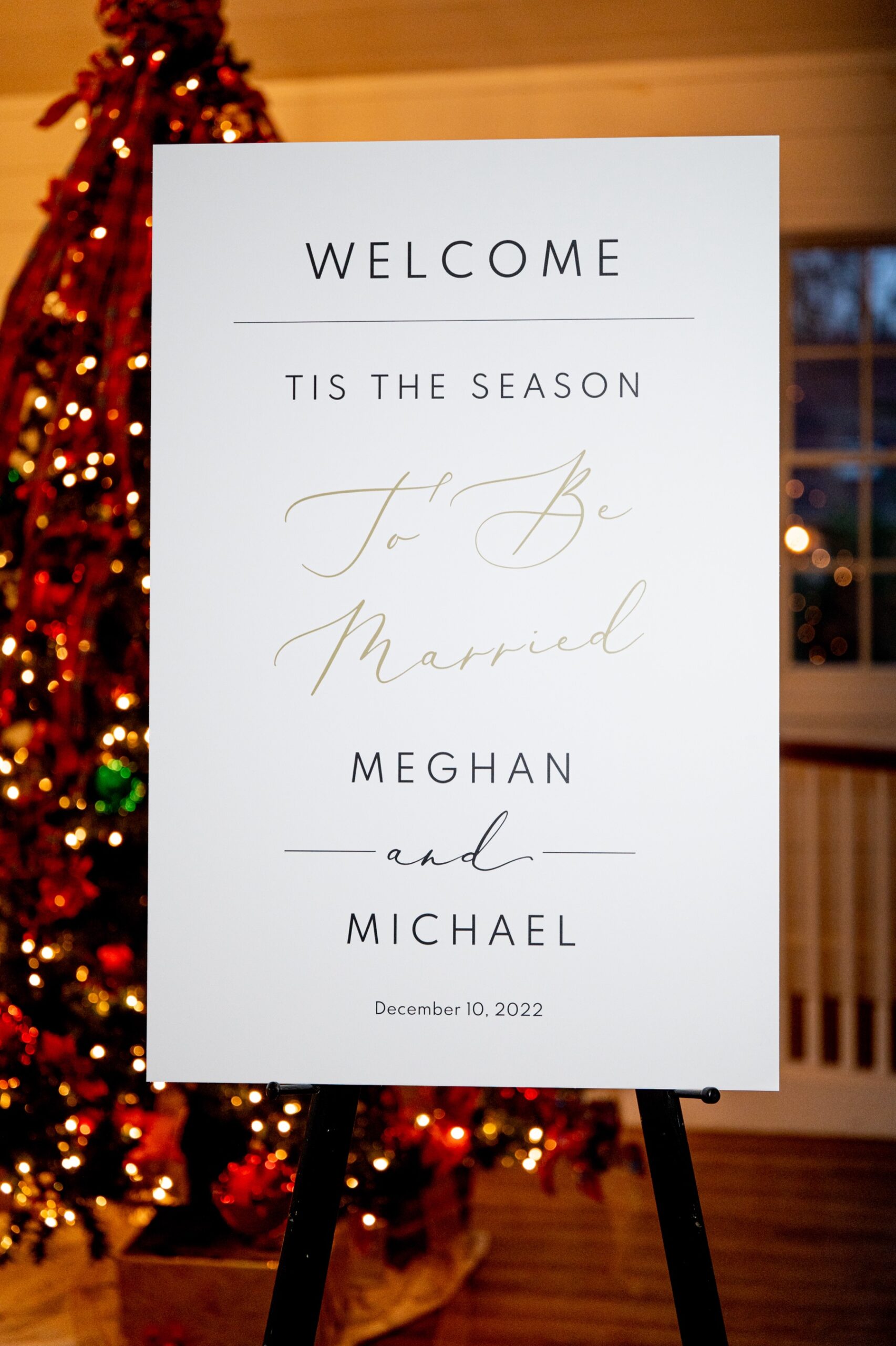 welcome wedding sign in front of lit up christmas tree for a Winter Wonderland Wedding