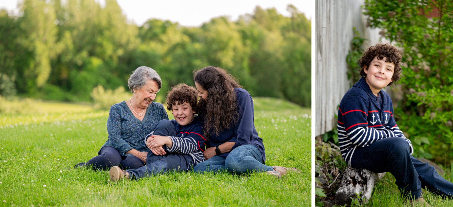 a young boy sitting in the grass with his mother and grandmother