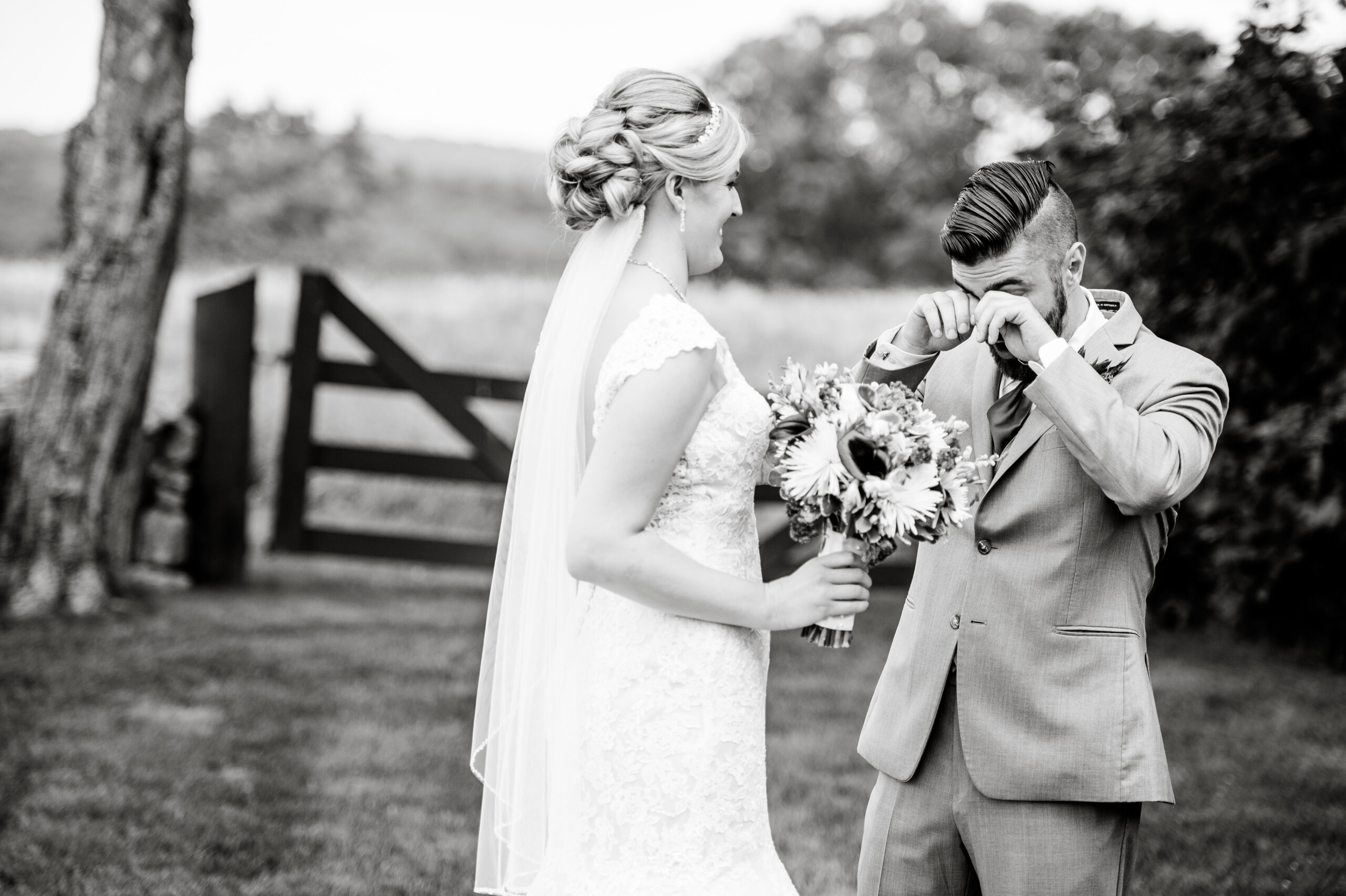 bride and groom during their first look with the groom in tears