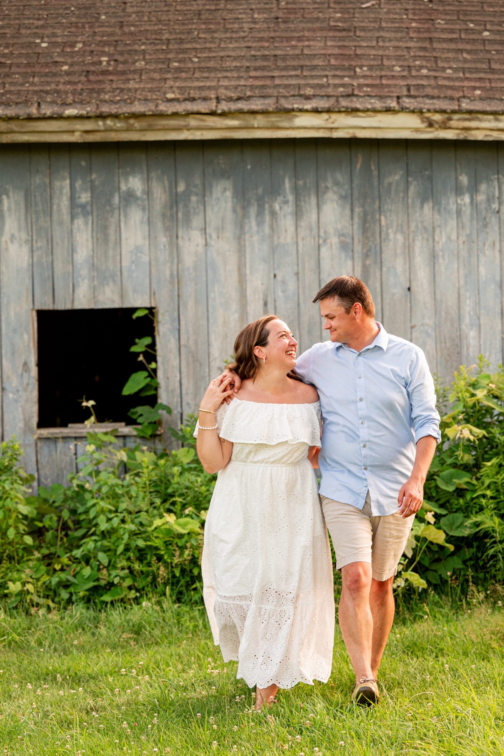 engaged couple looking at each other smiling at shaw farm
