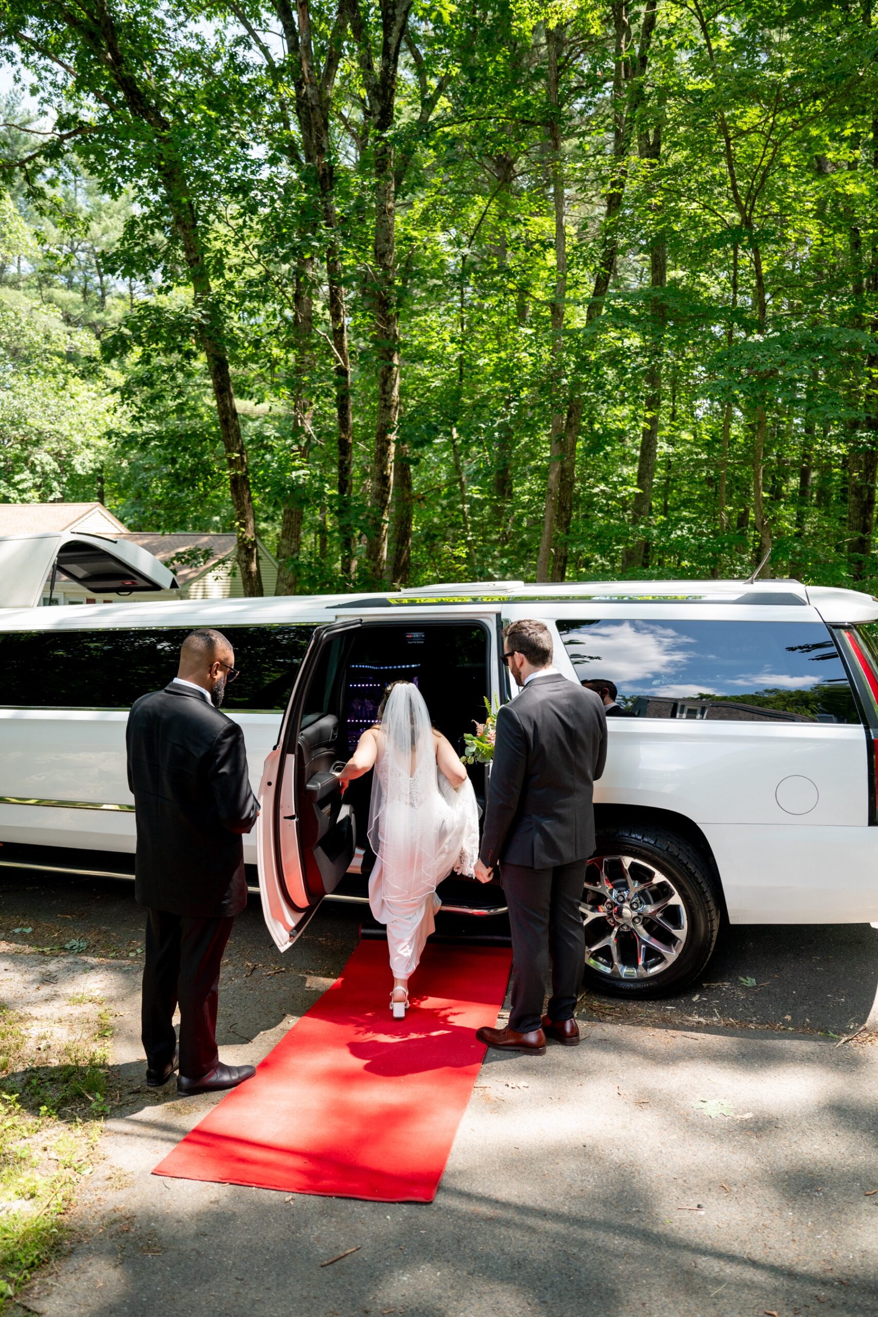 bride stepping into limo