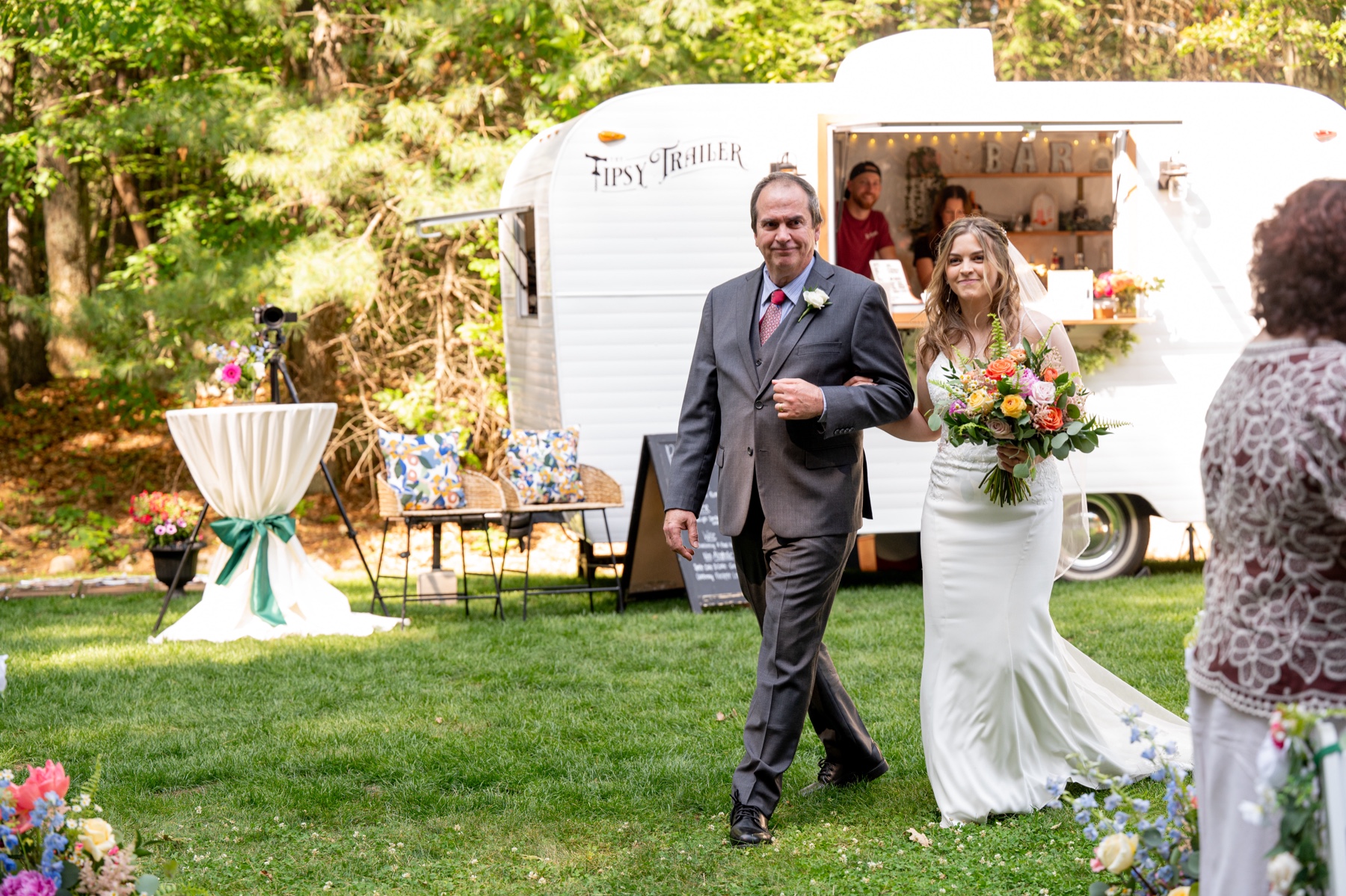 bride walking down the aisle with her father 