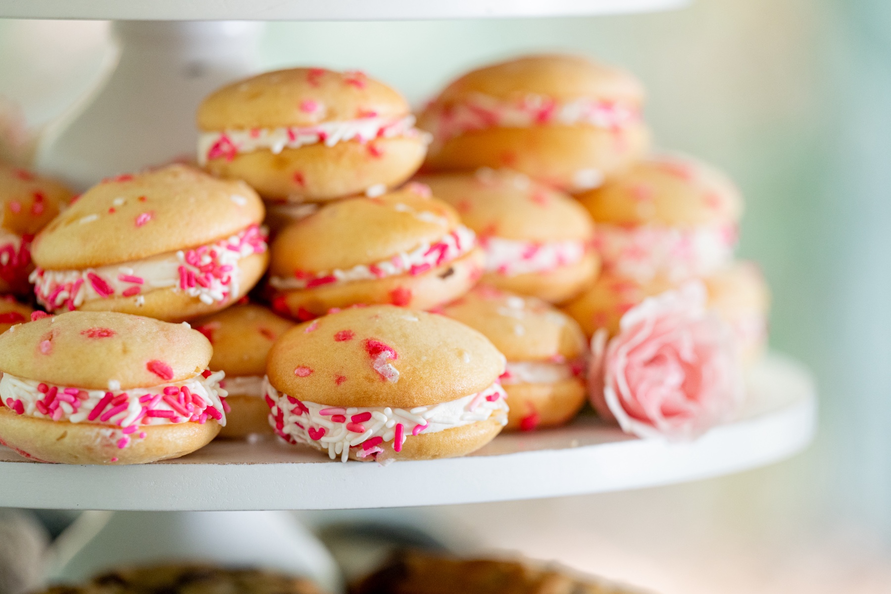 cream puff desserts with pink sprinkles 