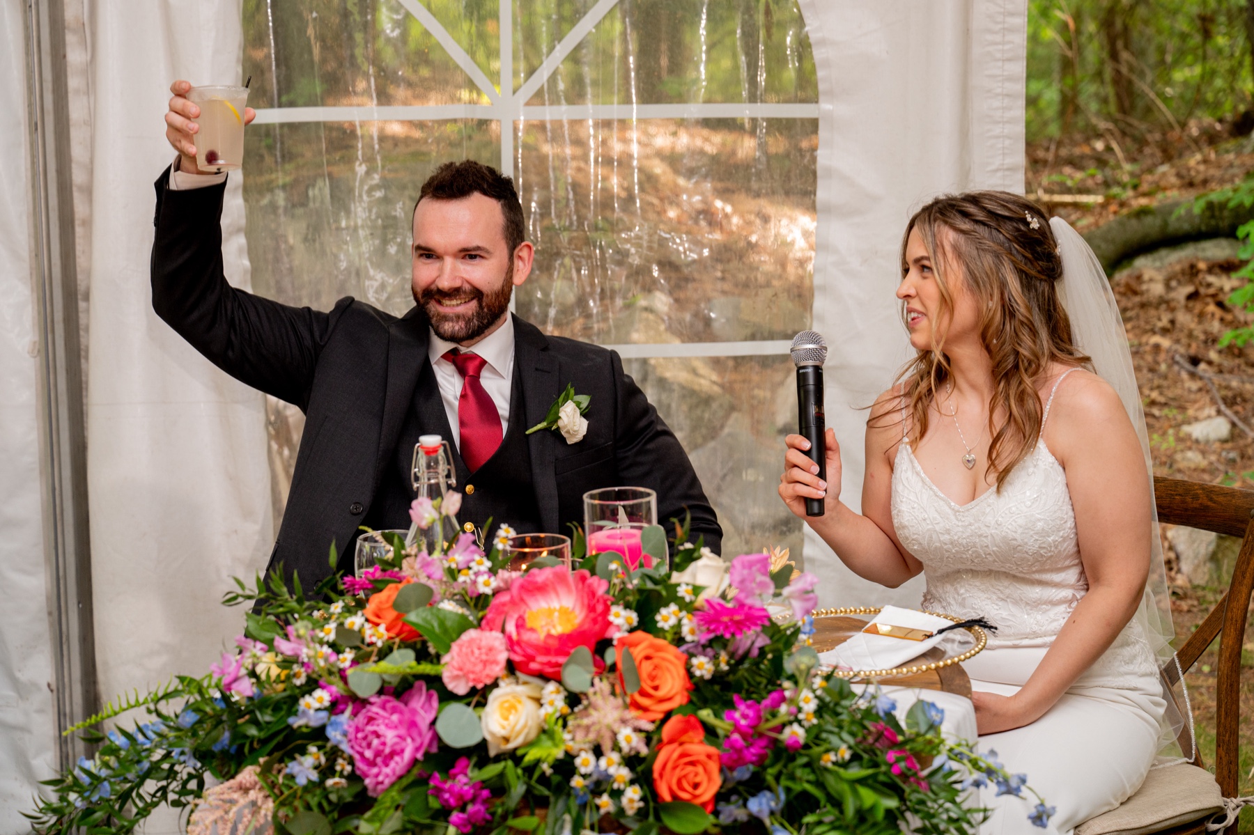 bride and groom give toast to wedding guests 