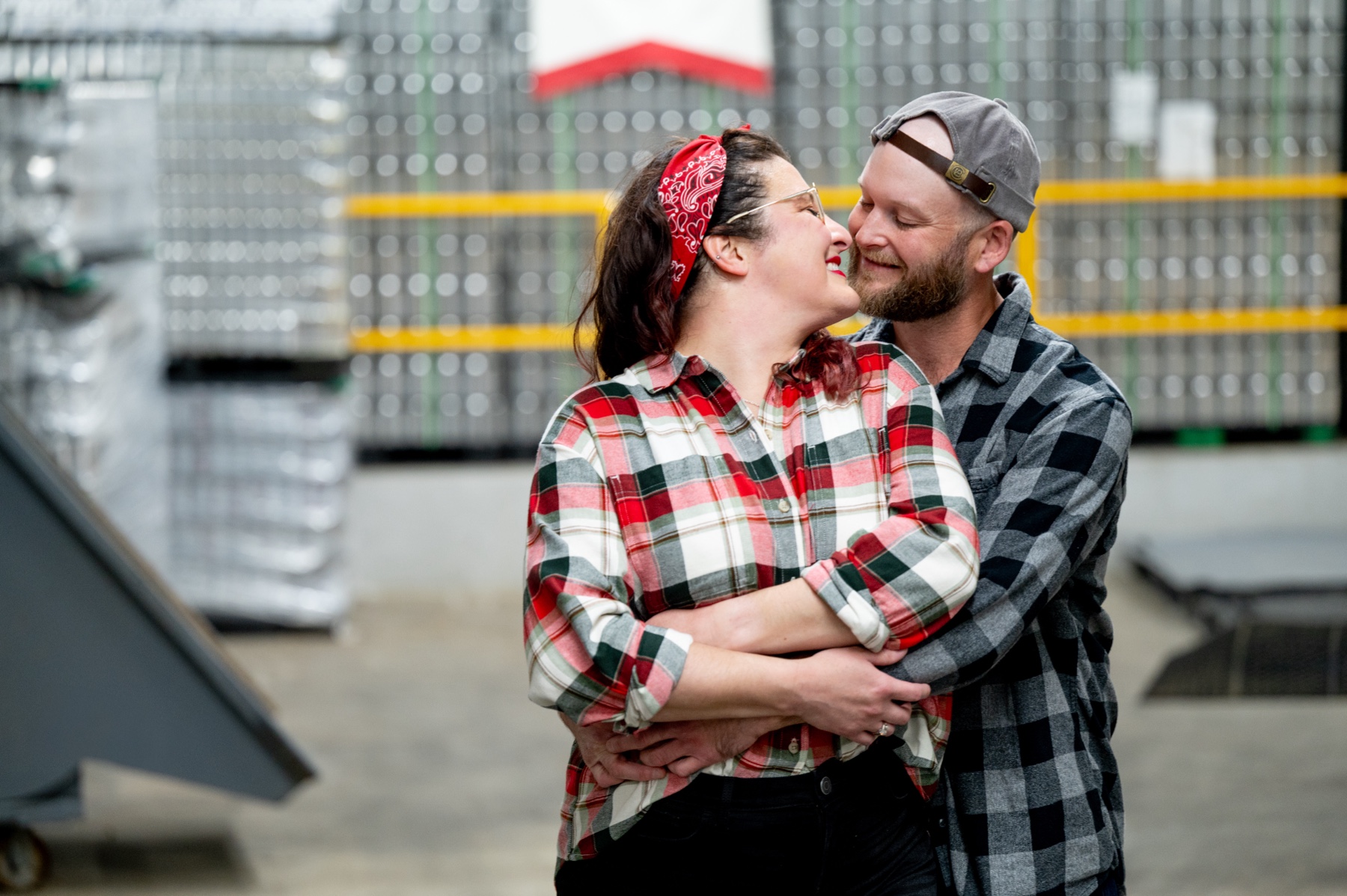 couple embracing for their narragansett brewery engagement session