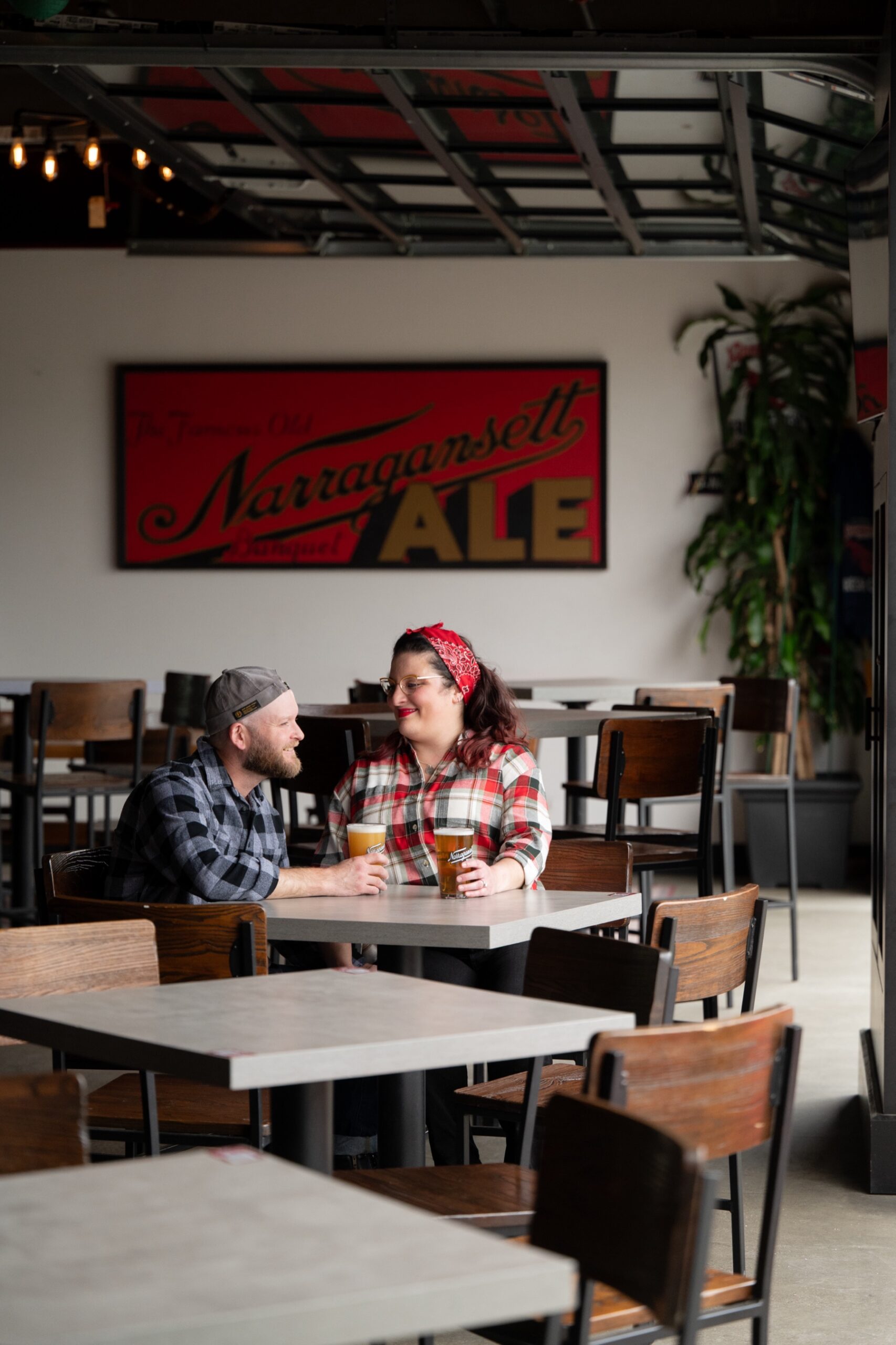 man and woman drinking beers at narragansett brewery 