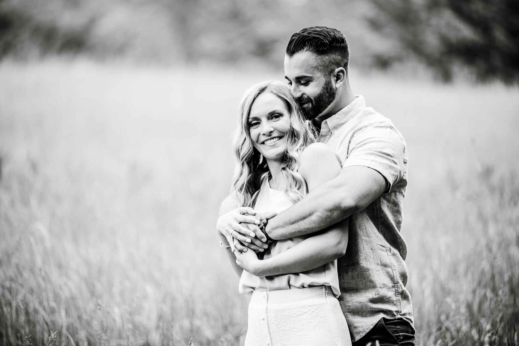 couple embracing during engagement session at moore state park