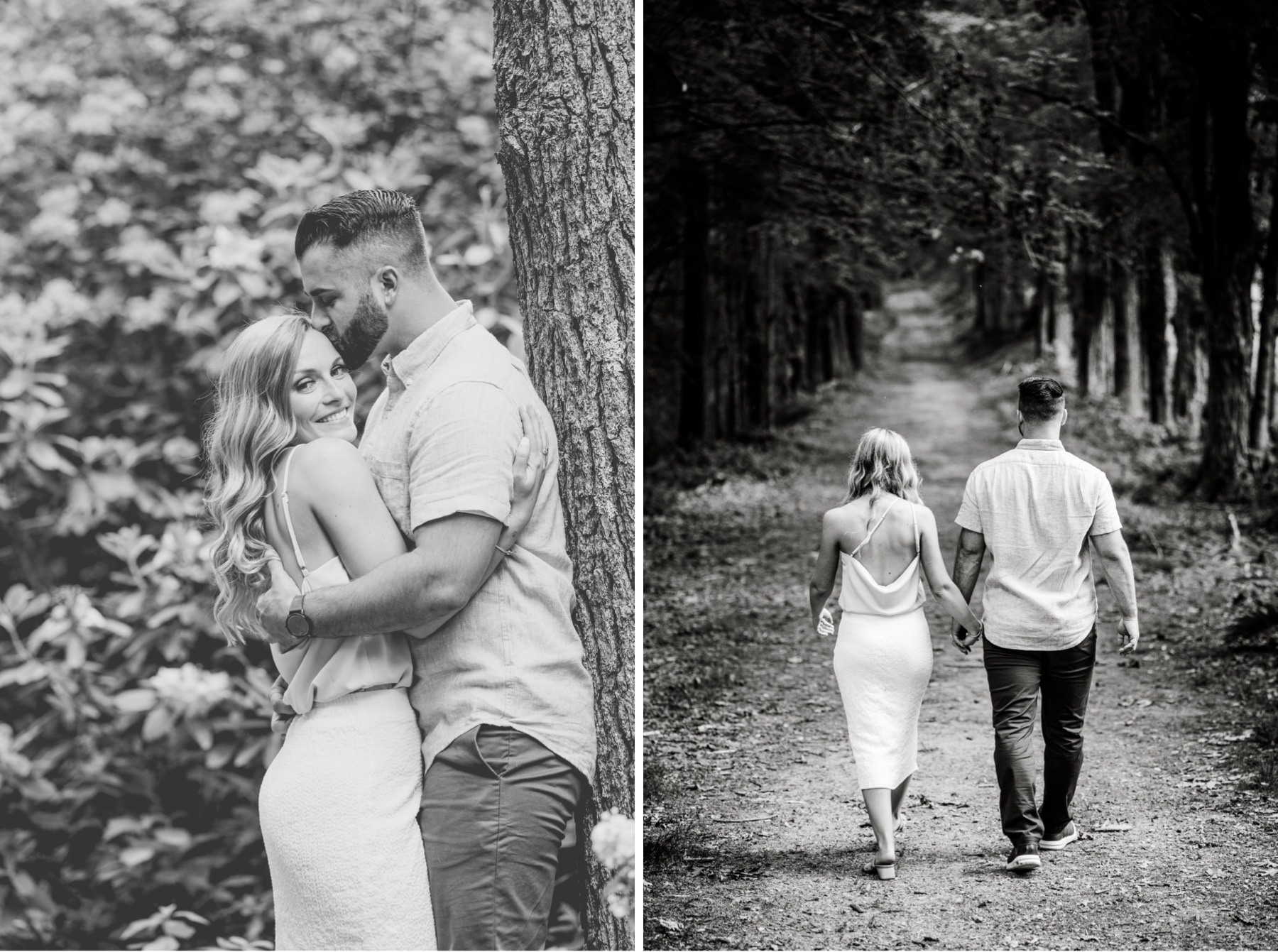 man and woman kissing and holding hands as they walk down park dirt road