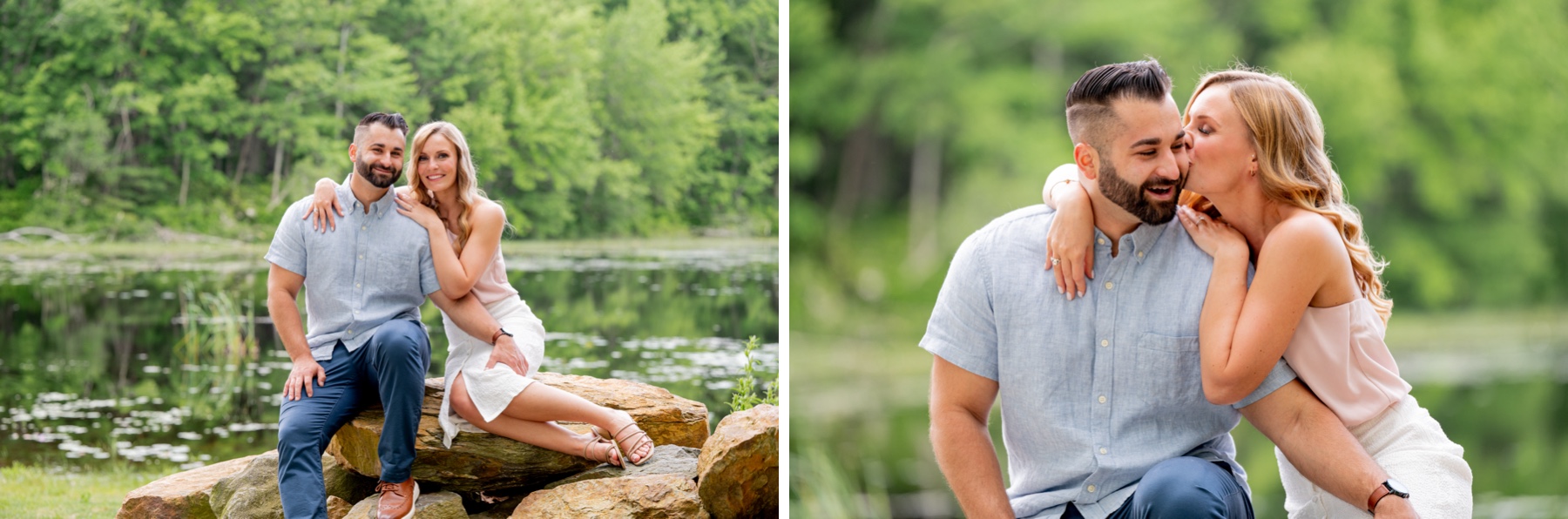 couple sitting in rocks smiling at the camera with a lake behind them during a Massachusetts engagement session