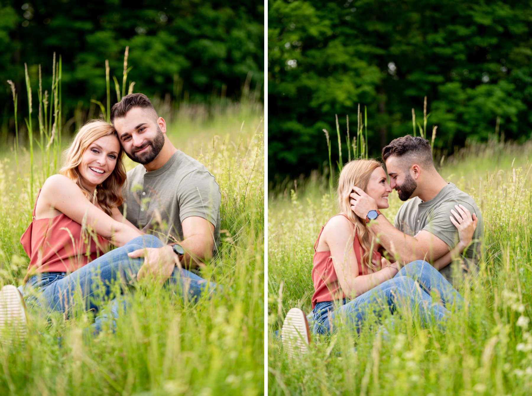 couple sitting in tall grass with white flowers kissing 
