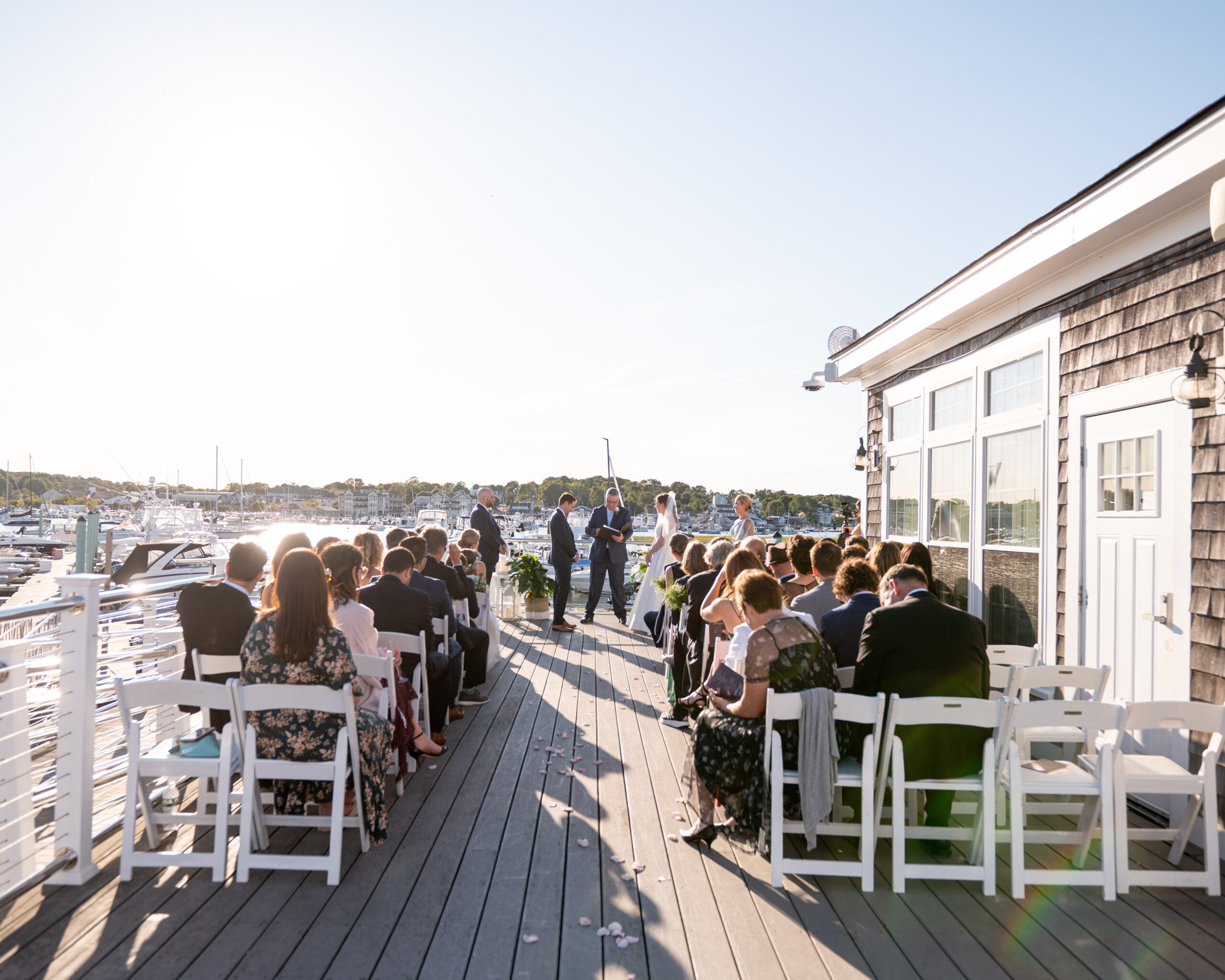 sunset on the water ceremony with harsh lighting for photos