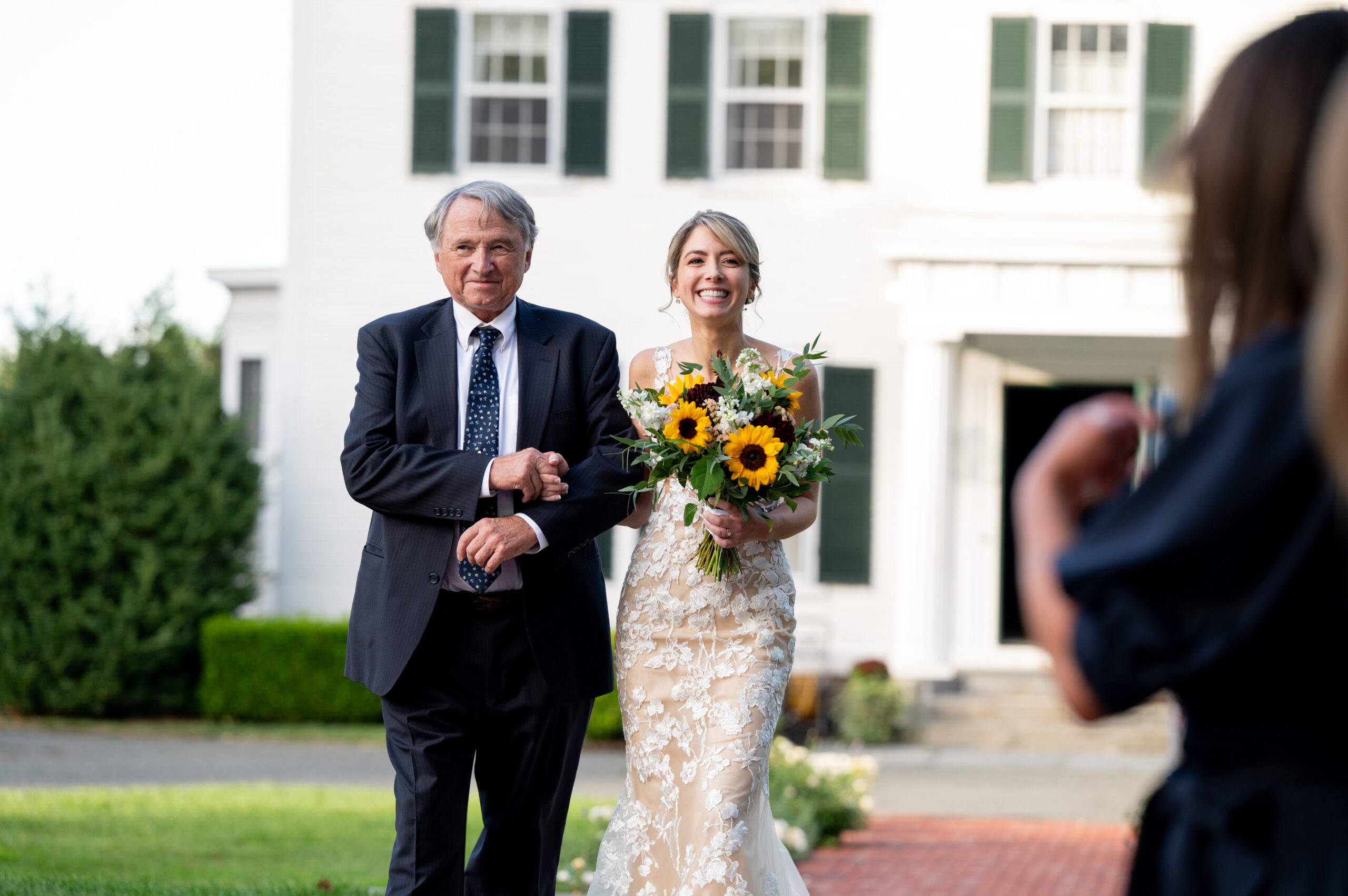 father of the bride walking daughter down the aisle for her sunlight ceremony