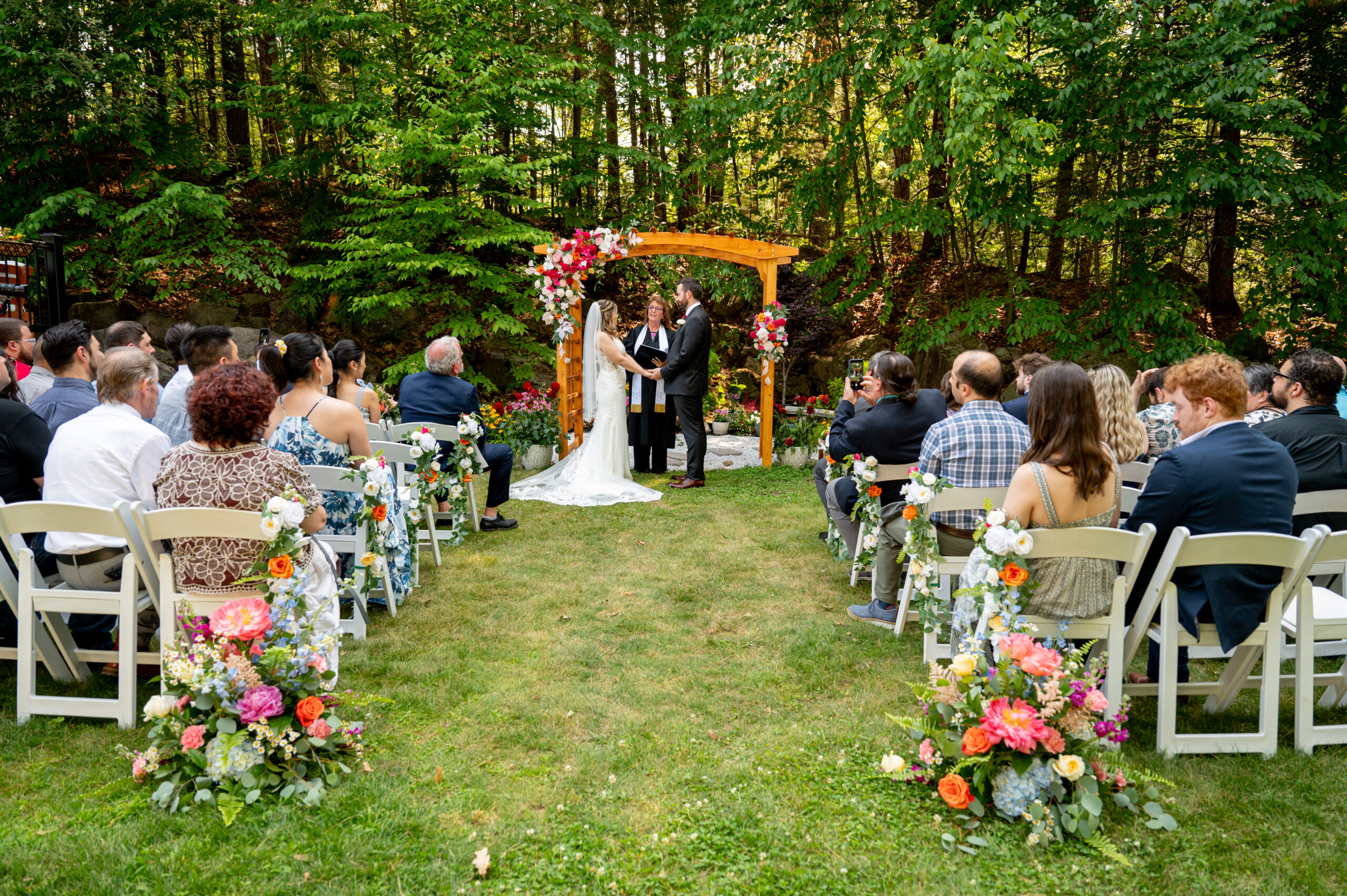 wedding ceremony in the summer in shaded forest 
