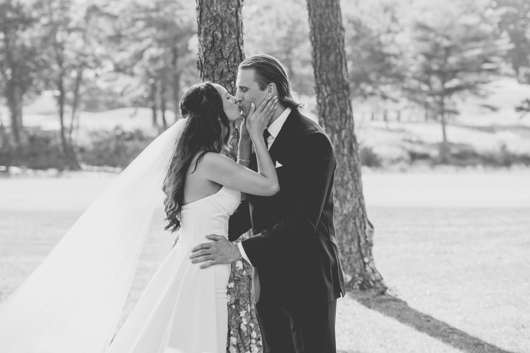 bride and groom kissing after their first look at their Willowbend Cape Cod Wedding 