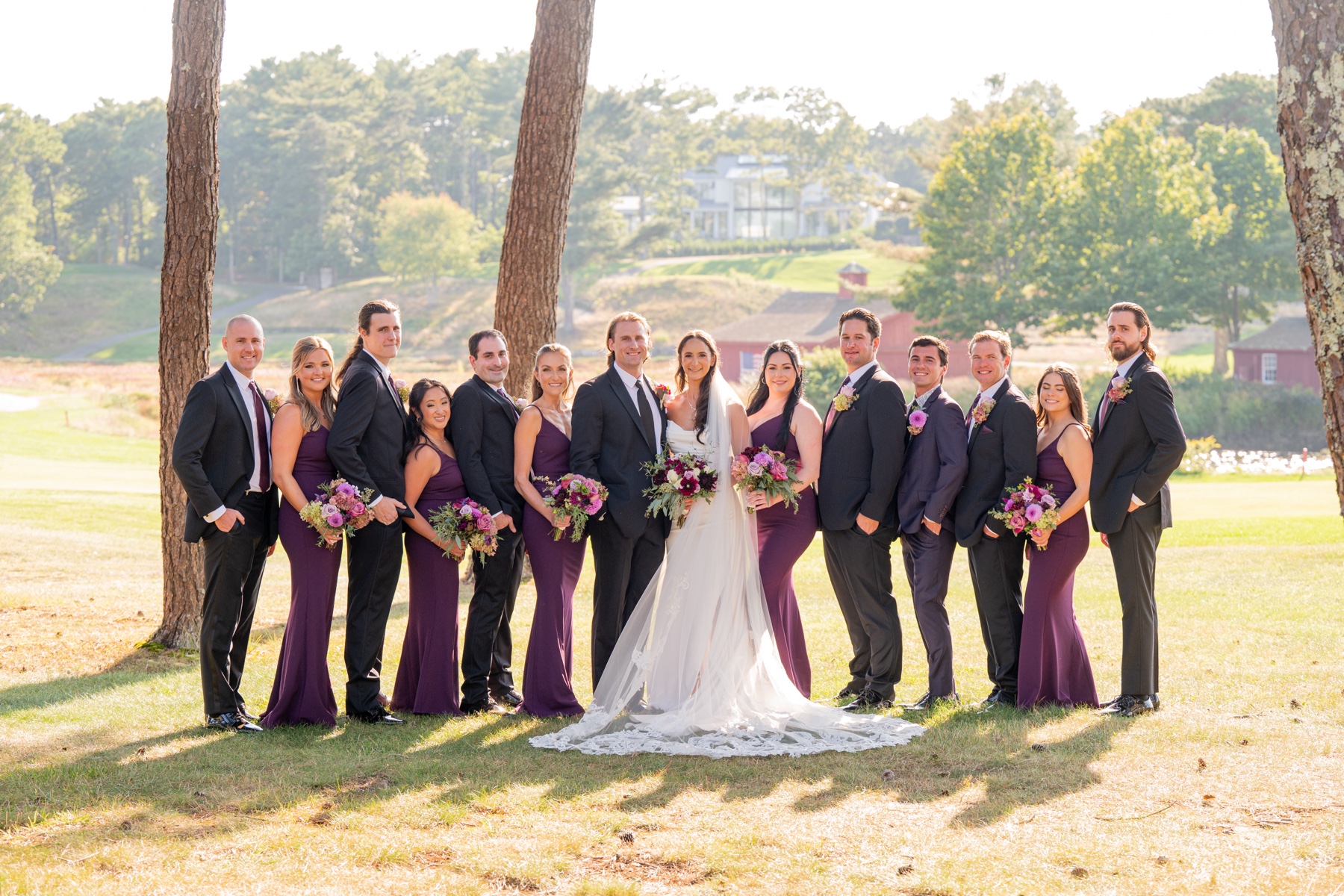 wedding party wearing grey suits and purple dresses at Willowbend Cape Cod Wedding