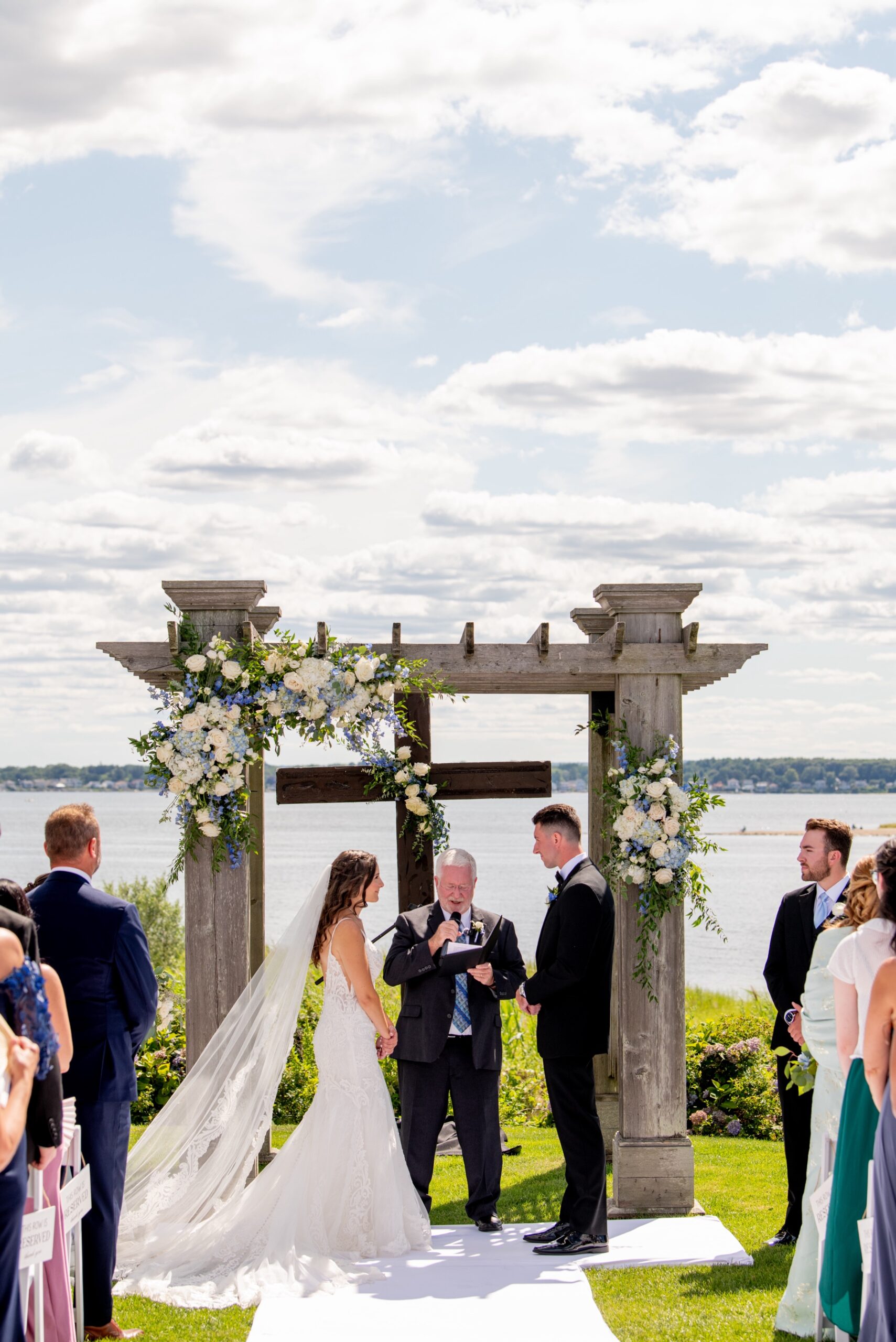 bride and groom standing at the altar of their Harbor Lights Wedding 
