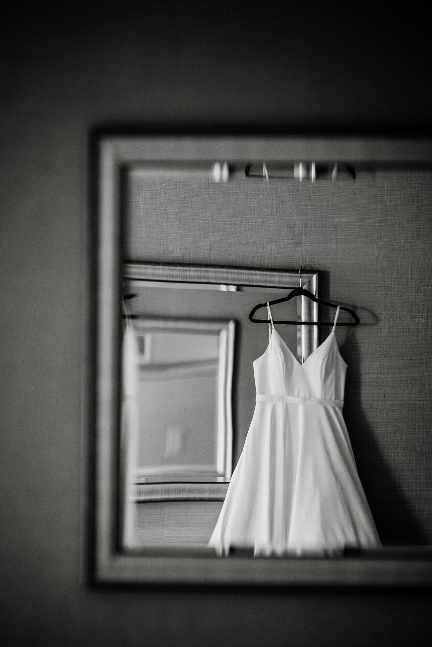 wedding dress hanging up on wedding day 