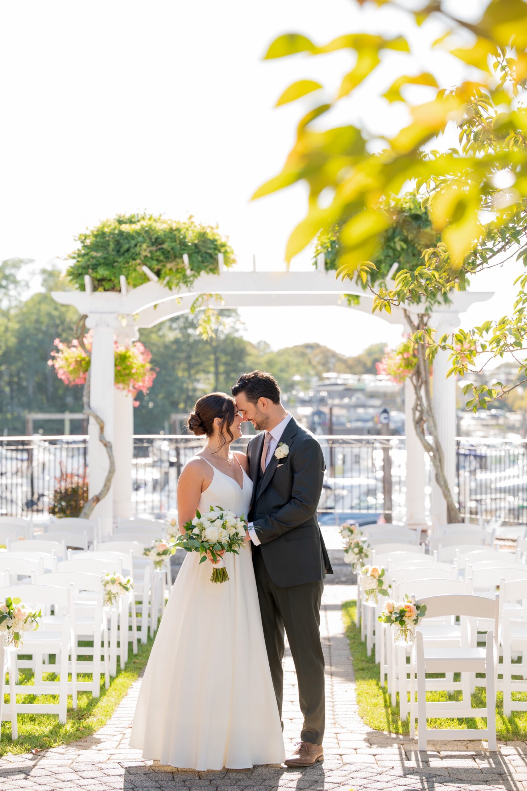 bride and groom embracing before their wedding ceremony outside