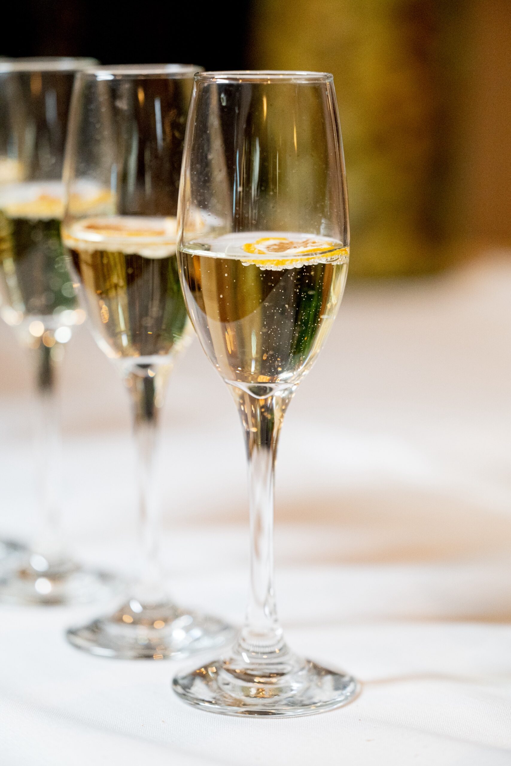 detail shot of champagne glass filled with champagne