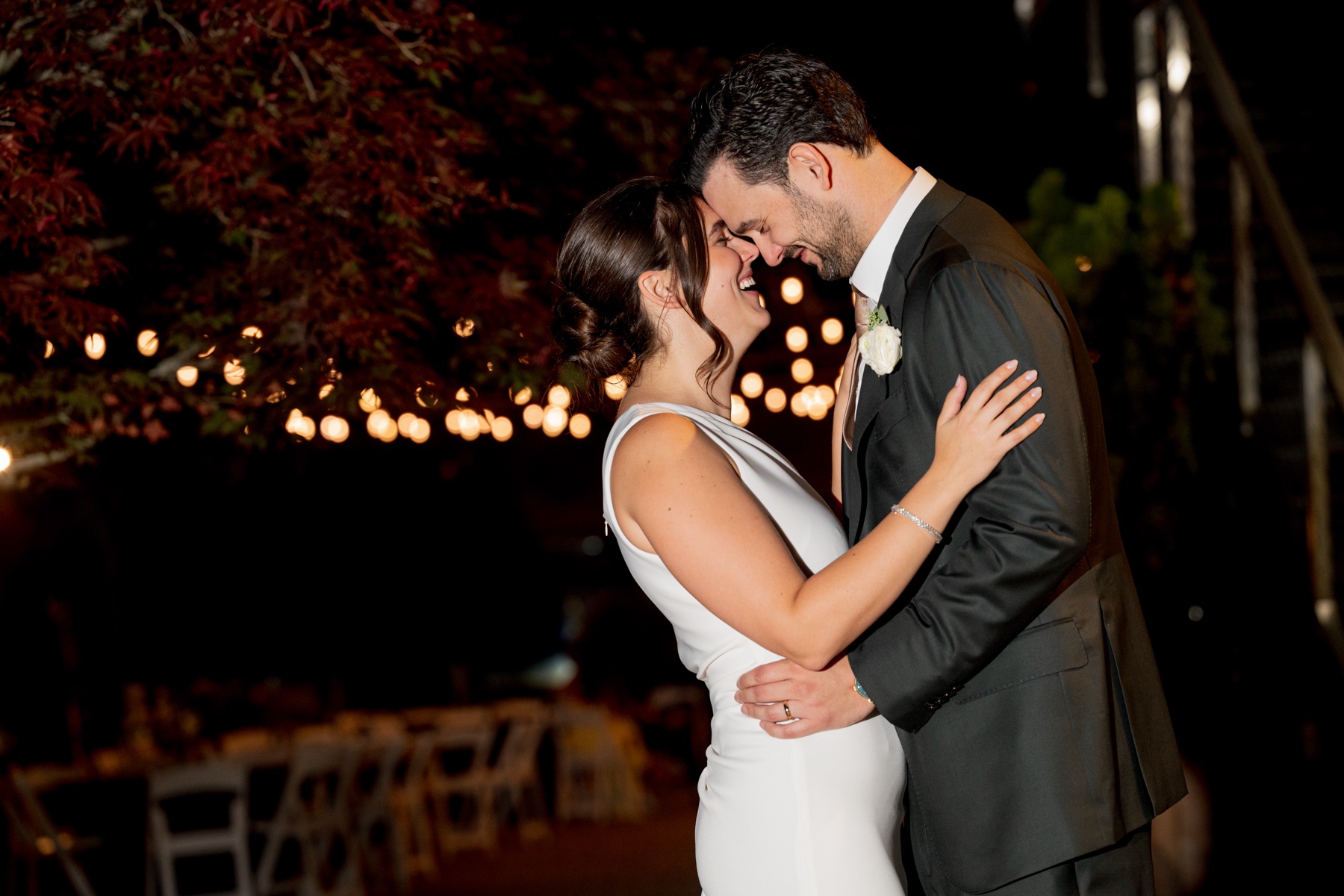 bride & groom embracing and laughing during wedding reception at the Terrace Ballroom at Danversport