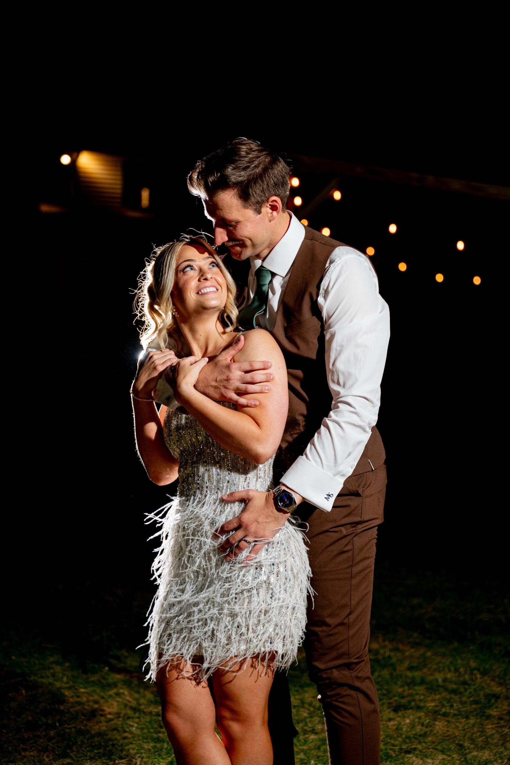 Bride & Groom in second outfit looking into each others eyes